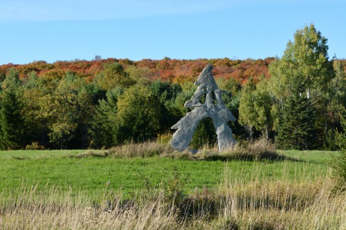 Large Statue infront of scenic hillside