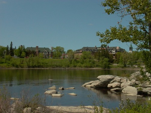 View of buildings from across the lake